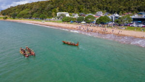 Paihia 200 - Waka and R Tucker Thompson Schooner meet on the water during the William's Family Reunion Beach Day