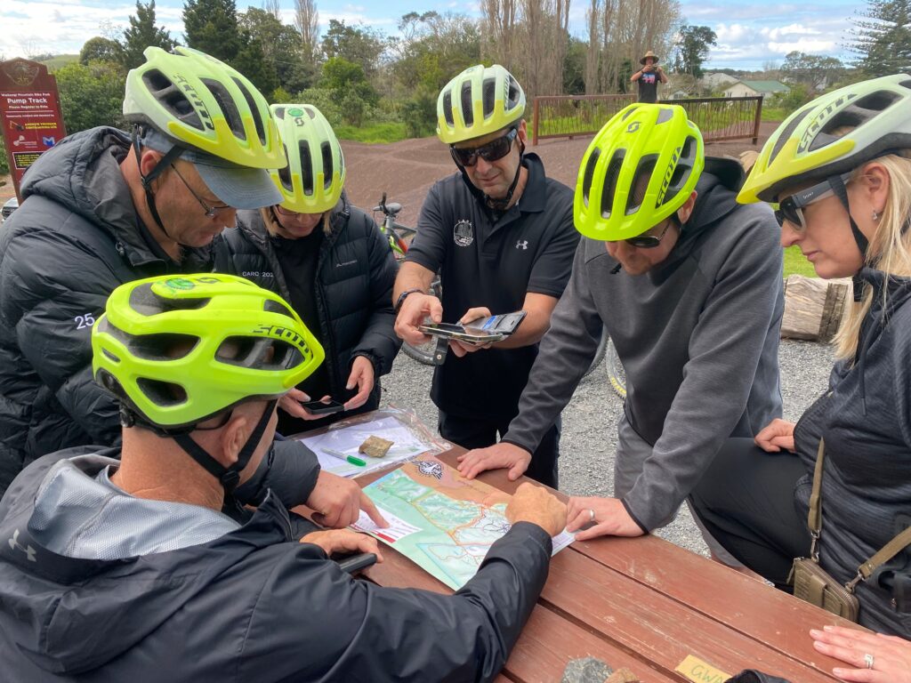 Team Building as the group strategise the best route for the Mountain Bike Orienteering at the Waitangi Mountain Bike Park